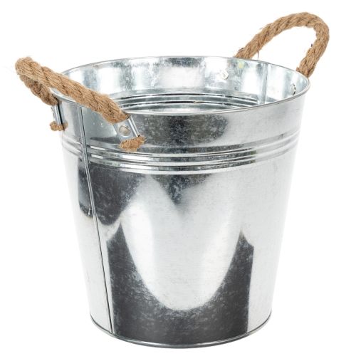 Lesklý kovový kbelík s