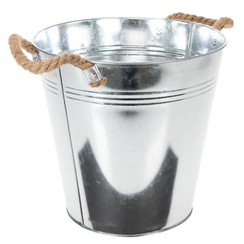 Lesklý kovový kbelík s