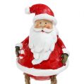 Floristik24 Dekorativní figurka Santa Claus sedící 6,5cm L10cm 4ks