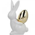Floristik24 Králíci se zlatým vejcem, keramickí králíci na Velikonoce ušlechtilý bílý, zlatý V13cm 2ks