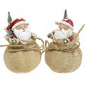 Floristik24 Deko figurka Santa Claus v pytli Vánoční dekorace Ø8cm/V13cm 2ks